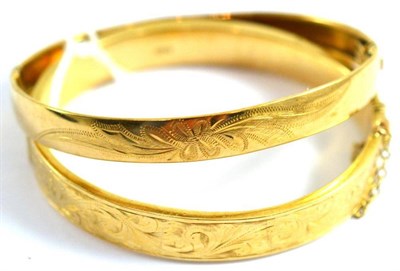 Lot 117 - A 9ct gold engraved front hinged bangle and another (a.f.) (2)