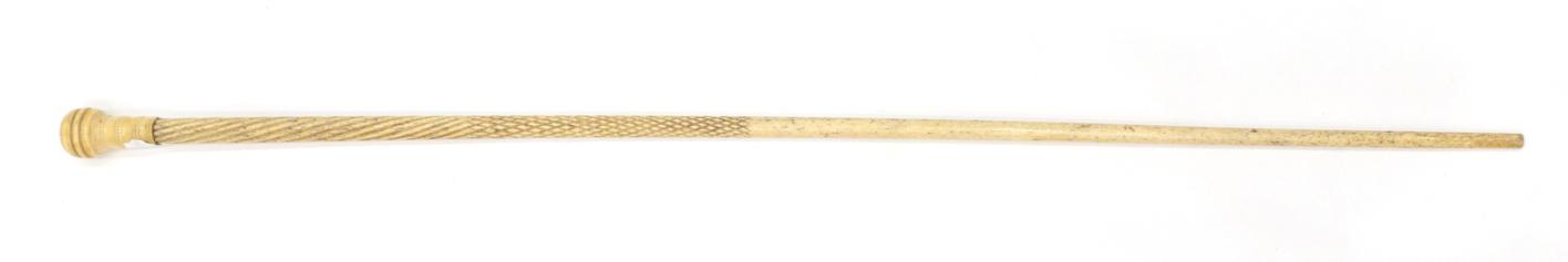 Lot 283 - A Bone Walking Stick, 19th century, the pommel with ebonised panel on an engine turned shaft,...