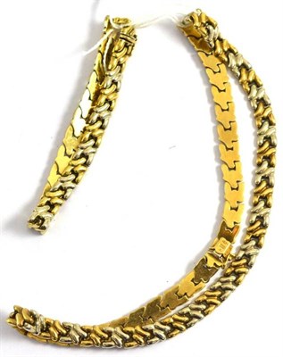 Lot 125 - A two colour gold necklace and a bracelet, clasps stamped with convention mark '375'