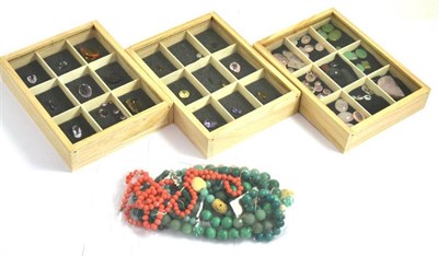 Lot 130 - Assorted gemstones in three display boxes, including citrine, amethyst, smoky quartz and rose...
