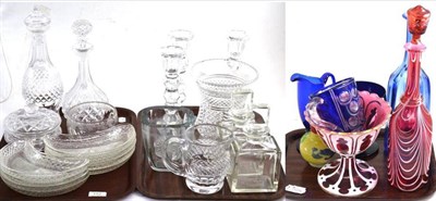 Lot 152 - Three trays including decanters, serving dishes, three cut glass candlesticks, a glass vase...