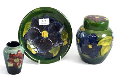Lot 174 - A Walter Moorcroft Clematis ginger jar and cover, on a green ground, impressed factory marks...