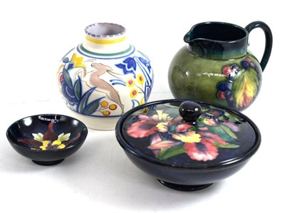 Lot 175 - A Moorcroft Leaf and Berry jug, a Moorcroft Orchid bowl and cover, a Moorcroft Columbine small dish