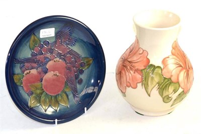 Lot 176 - A William John Moorcroft Coral Hibiscus pattern vase, on a white ground, impressed factory...