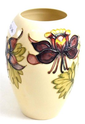 Lot 177 - A Walter Moorcroft Columbine pattern vase, on a white ground, impressed factory marks and green...
