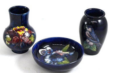 Lot 181 - A Walter Moorcroft Orchid pattern bowl, on a blue ground, impressed factory marks, 11.5cm; a...
