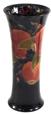 Lot 201 - A William Moorcroft Pomegranate pattern trumpet vase, on a blue ground, impressed BURSLEM...