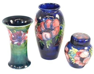 Lot 206 - A Walter Moorcroft Anemone pattern vase, of trumpet design, on a green/blue ground, impressed...