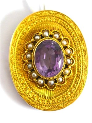 Lot 224 - A Victorian amethyst and split pearl brooch