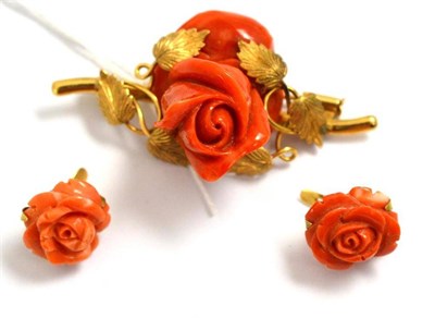 Lot 238 - A coral brooch in the form of a rose and a similar pair of earrings