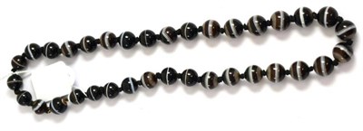 Lot 241 - A sardonyx bead necklace