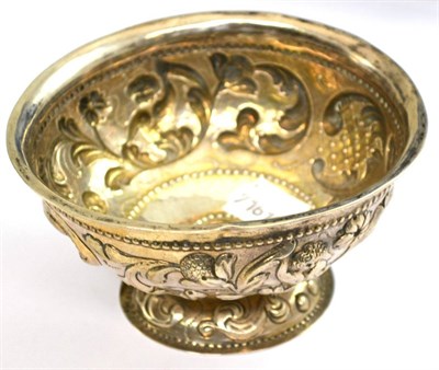 Lot 243 - A 19th century Dutch silver brandy bowl, with typical repousse decoration of scrolls and...