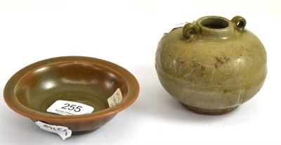 Lot 255 - A Chinese celadon glazed vessel and a shallow dish decorated with two carp