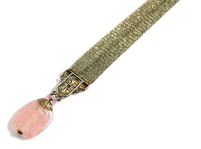 Lot 307 - An Arts and Crafts Silver bracelet with pink glass pendant