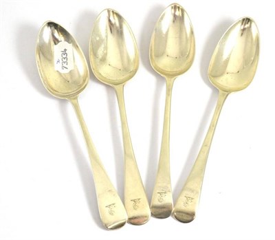 Lot 315 - Four George III silver tablespoons engraved with a family crest