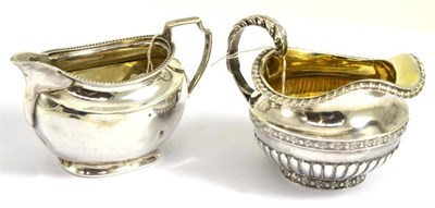 Lot 324 - Two silver milk jugs