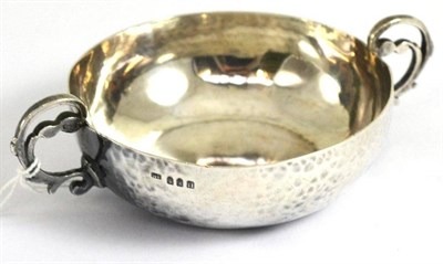 Lot 326 - A hammered silver twin handled sugar bowl