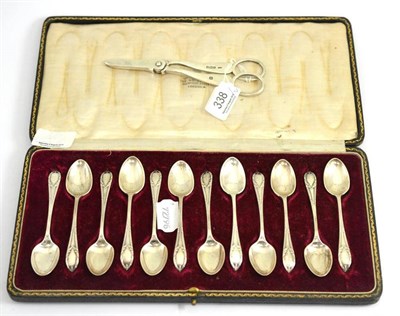 Lot 338 - A cased set of silver teaspoons and a pair of grape scissors