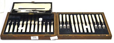 Lot 339 - A set of silver and mother-of-pearl knives and forks, together with a cased knife and fork set