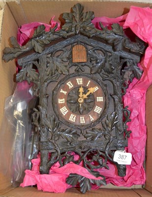 Lot 387 - Cuckoo clock, with two weights and a pendulum