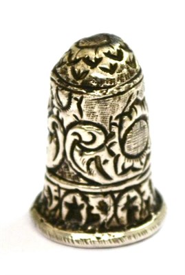 Lot 420 - A silver thimble, probably 19th century Dutch, decorated in repousse with flowers and scrolls