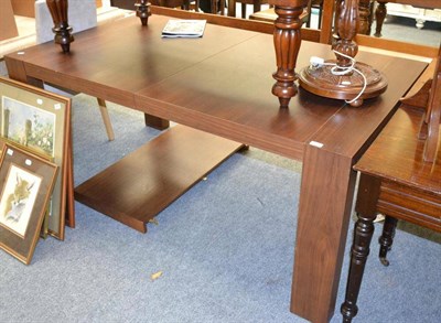 Lot 1034 - Modern dining table with one leaf