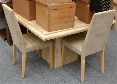 Lot 1036 - A modern Travertine table on a pedestal base and four suede upholstered dining chairs