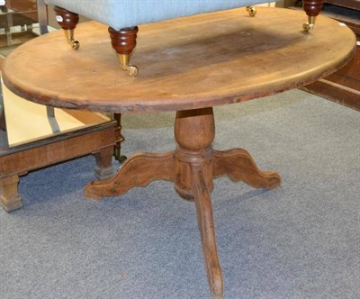 Lot 1043 - A late Victorian pine oval top pedestal table