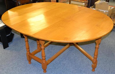 Lot 1054 - Albert ";Eagleman"; Jeffray oak gate leg table, the oval top on turned supports joined by...