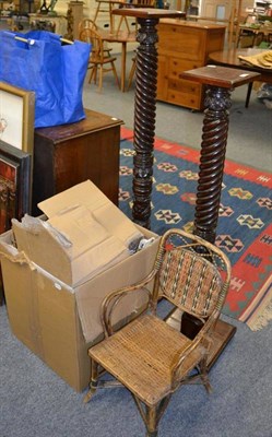 Lot 1063 - A pair of mahogany bedpost torcheres, caned child's armchair, two 1912 mezzotints of elegant...