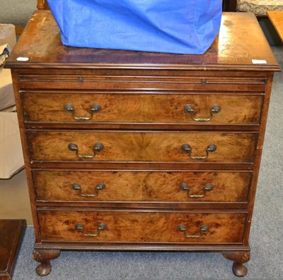 Lot 1064 - Walnut straight fronted chest with brushing slide