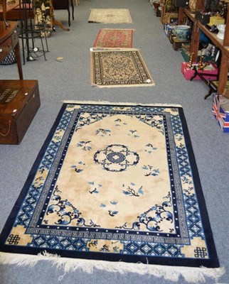 Lot 1068 - Chinese silk rug, The ivory field with columns of birds and plants framed by spandrels and...