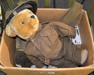 Lot 1094 - A Deans replica yellow mohair jointed Teddy bear, with black stitched nose wearing an army...