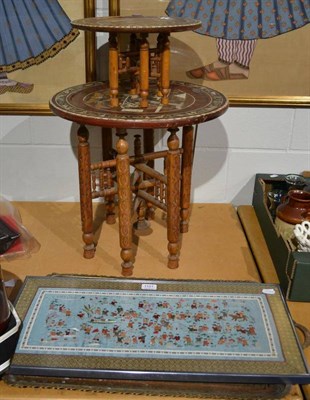 Lot 1101 - Two inlaid circular tables, Eastern brass tray and a silkwork panel