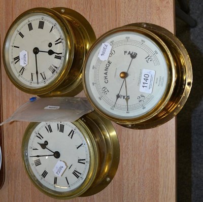 Lot 1140 - Two brass clocks and a brass barometer