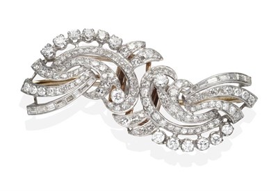 Lot 347 - An Art Deco Diamond Double Clip Brooch, pierced scrolls set throughout with round brilliant...