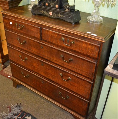 Lot 1198 - # George III oak five drawer straight fronted chest of drawers