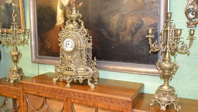 Lot 1206 - A modern mantel clock with garniture