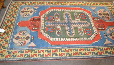 Lot 1207 - Kozak rug, West Anatolia, the sky blue field centred by an olive green octagon enclosed by...