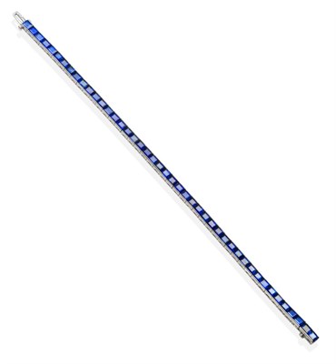 Lot 352 - A Sapphire Line Bracelet, of channel set step cut sapphires, length 18.5cm see illustration