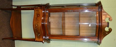 Lot 1215 - * An Edwardian serpentine shaped display cabinet