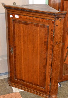 Lot 1223 - An oak and mahogany crossbanded hanging corner cupboard