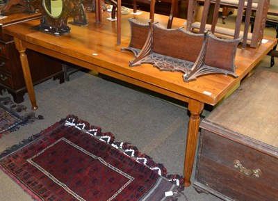 Lot 1226 - A pair of modern dining tables on reeded legs