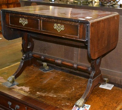 Lot 1229 - Overmantle mirror, stoneware jar, reproduction mahogany sofa table and a bookcase