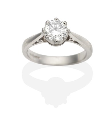 Lot 354 - A Platinum Solitaire Diamond Ring, a round brilliant cut diamond in a claw setting, to tapering...