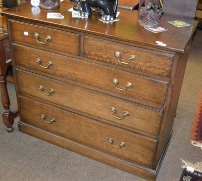 Lot 1243 - An oak five drawer straight fronted chest