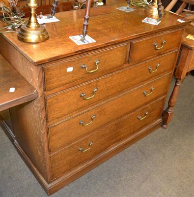 Lot 1244 - An oak five drawer straight fronted chest