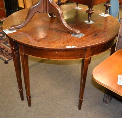 Lot 1256 - A pair of George III mahogany semi-circular dining table ends