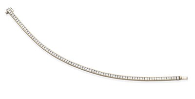 Lot 359 - A Princess Cut Diamond Line Bracelet, channel set as individual links, total estimated diamond...