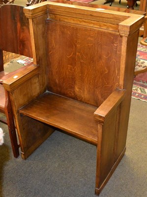 Lot 1276 - An oak hall seat with boarded seat and back support